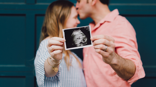 babyheart australia pregnant couple holding ultrasound photo