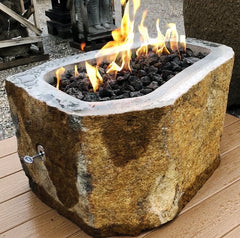 A natural andesite basalt real stone outdoor gas fire pit from Impact Imports in Boise, Idaho.
