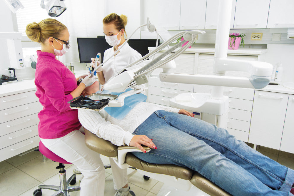 dentist using salli saddle seat