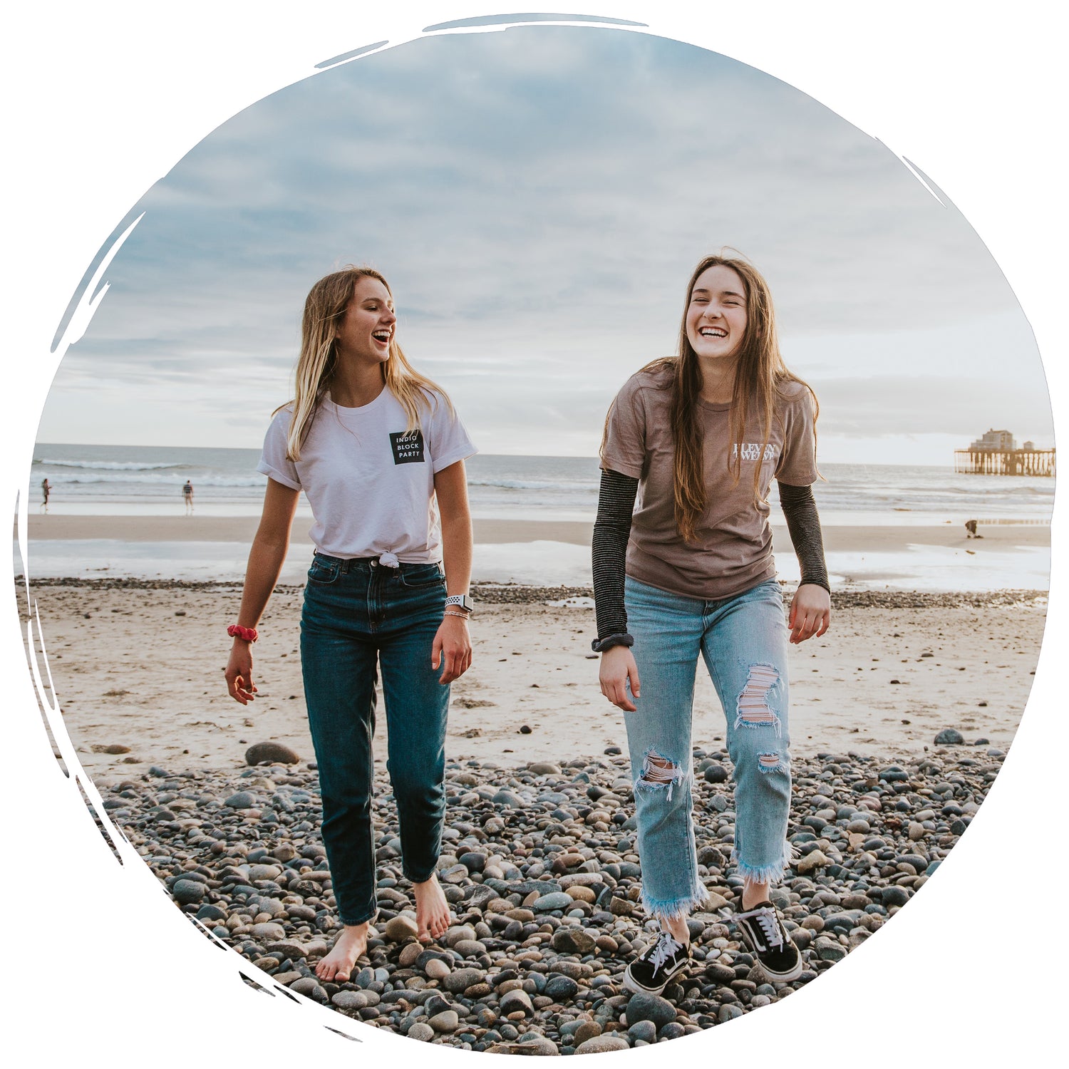 two friends laughing while walking on a beach - getpinkfit Brand Ambassador Program
