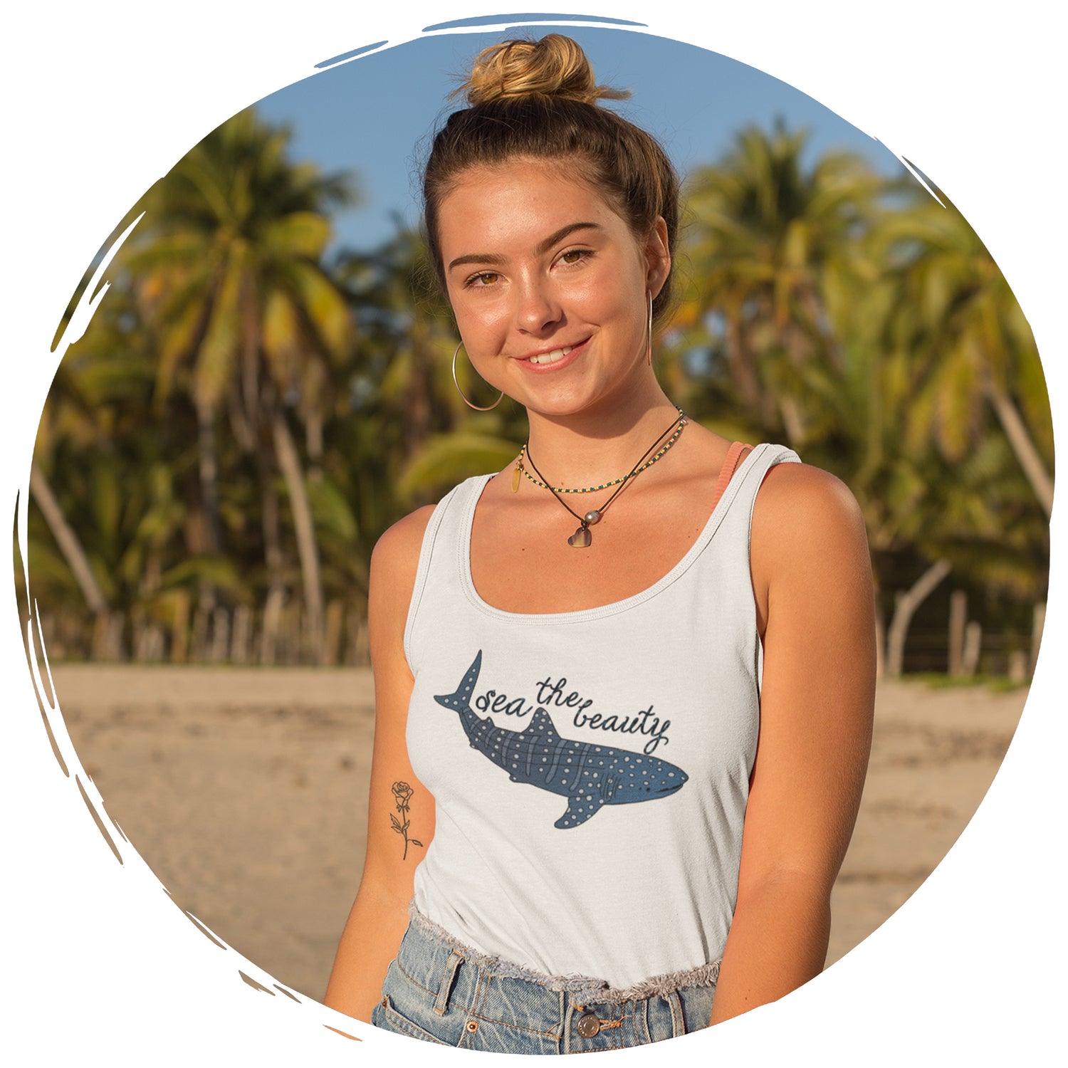 girl on beach with palm trees in background wearing getpinkfit's Sea The Beauty Whale Shark Tank Top - getpinkfit Brand Ambassador Program