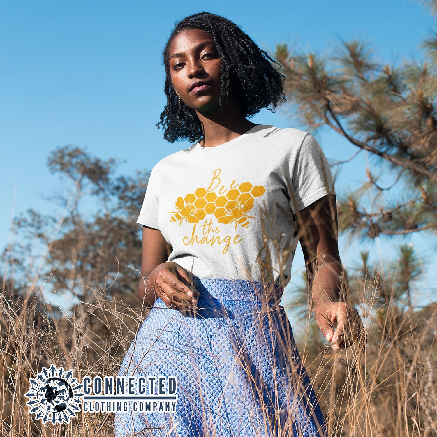 Model Wearing White Organic Cotton Bee The Change Short-Sleeve Tee - sweetsherriloudesigns - Ethically and Sustainably Made - 10% of profits donated to the Honeybee Conservancy