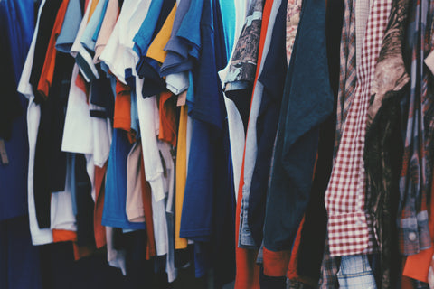 Closet full of T-shirts and other colorful clothing