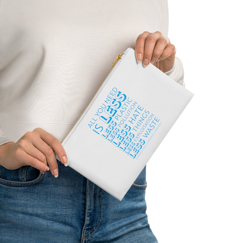 Model Holding White All You Need Is Less Cosmetic Bag reads "all you need is less. less plastic. less pollution. less hate. less things. less exploitation. less waste." - sweetsherriloudesigns - Ethically and Sustainably Made - 10% of profits donated to Mission Blue ocean conservation