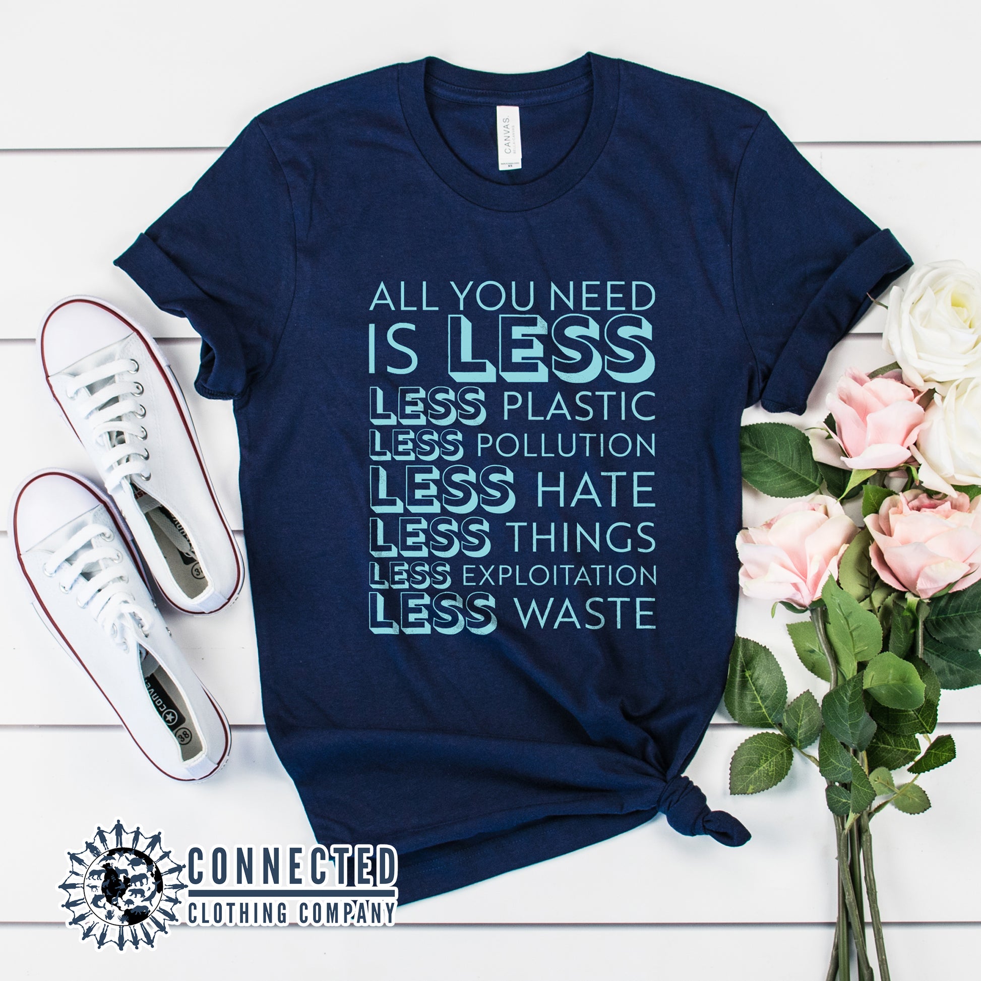 Navy Blue All You Need Is Less Short-Sleeve Unisex Tee reads "all you need is less. less plastic. less pollution. less hate. less things. less exploitation. less waste." - sweetsherriloudesigns - Ethically and Sustainably Made - 10% of profits donated to Mission Blue ocean conservation