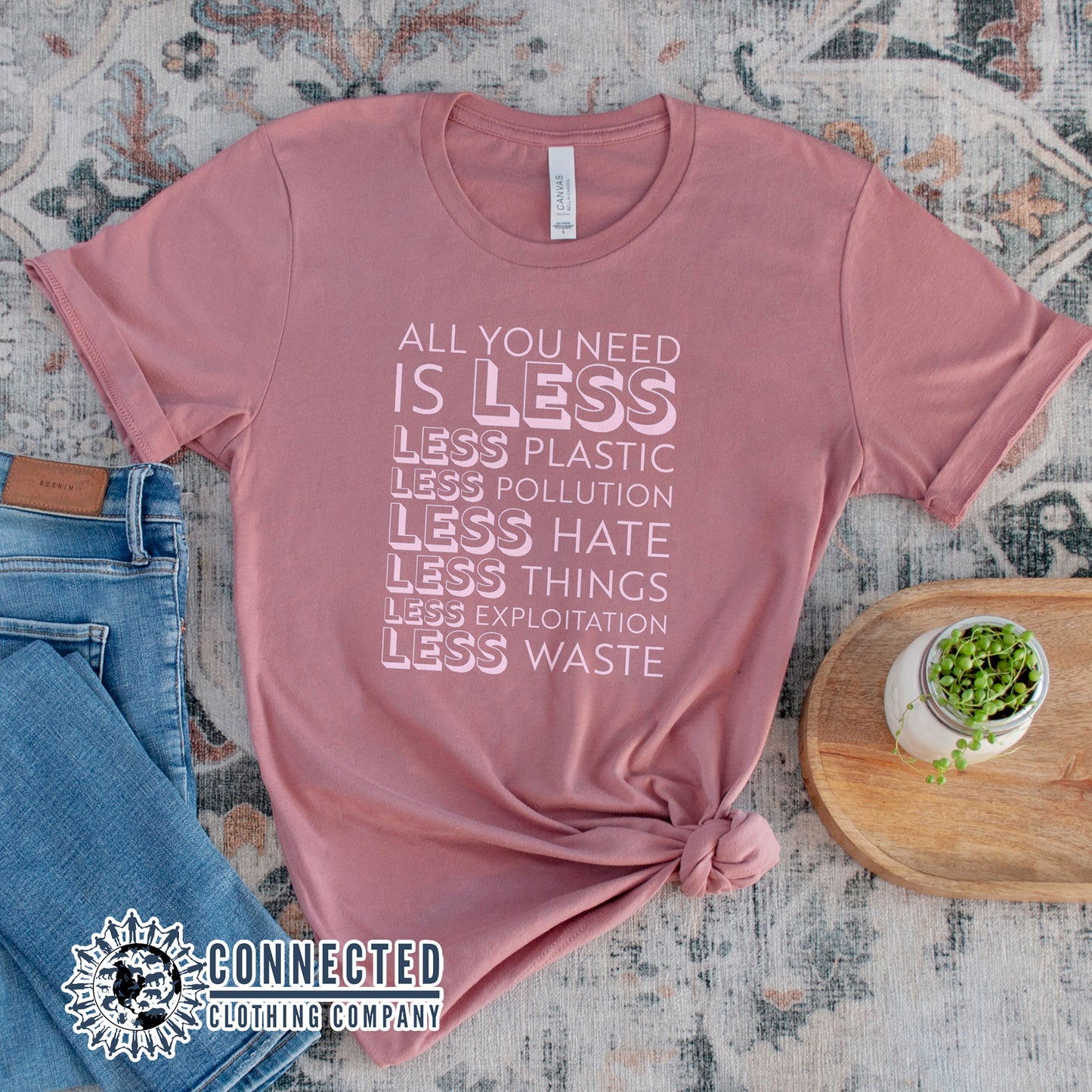 Mauve All You Need Is Less Short-Sleeve Unisex Tee reads "all you need is less. less plastic. less pollution. less hate. less things. less exploitation. less waste." - sweetsherriloudesigns - Ethically and Sustainably Made - 10% of profits donated to Mission Blue ocean conservation