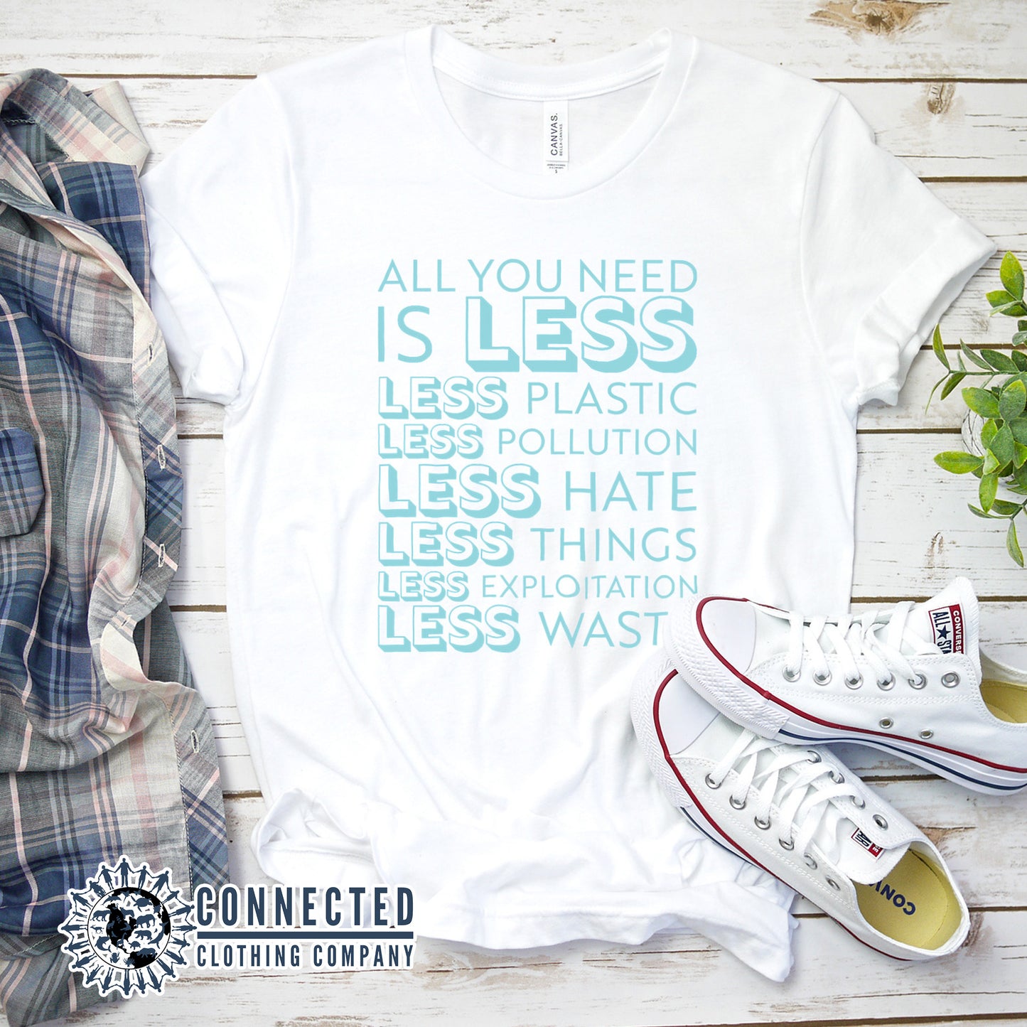 White All You Need Is Less Short-Sleeve Unisex Tee reads "all you need is less. less plastic. less pollution. less hate. less things. less exploitation. less waste." - sweetsherriloudesigns - Ethically and Sustainably Made - 10% of profits donated to Mission Blue ocean conservation