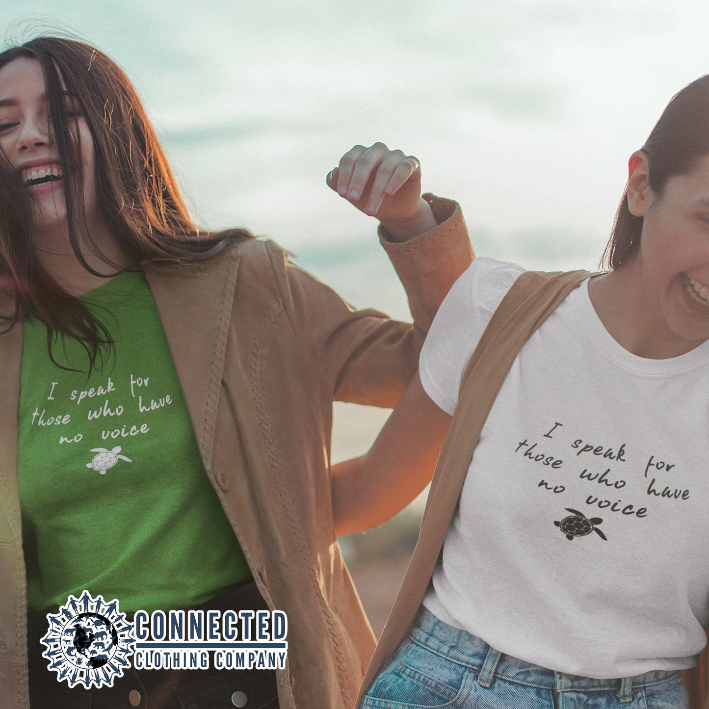 2 Friends Wearing A Kelly Green Be The Voice Sea Turtle Tee reads "I speak for those who have no voice." And A White Tee - sweetsherriloudesigns - Ethically and Sustainably Made - 10% donated to the Sea Turtle Conservancy