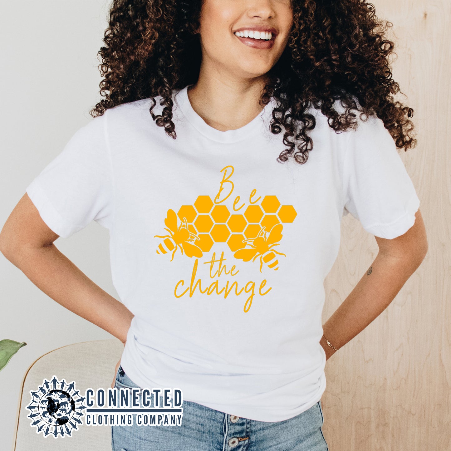 Model Wearing White Bee The Change Short-Sleeve Tee - sweetsherriloudesigns - 10% of profits donated to the Honeybee Conservancy