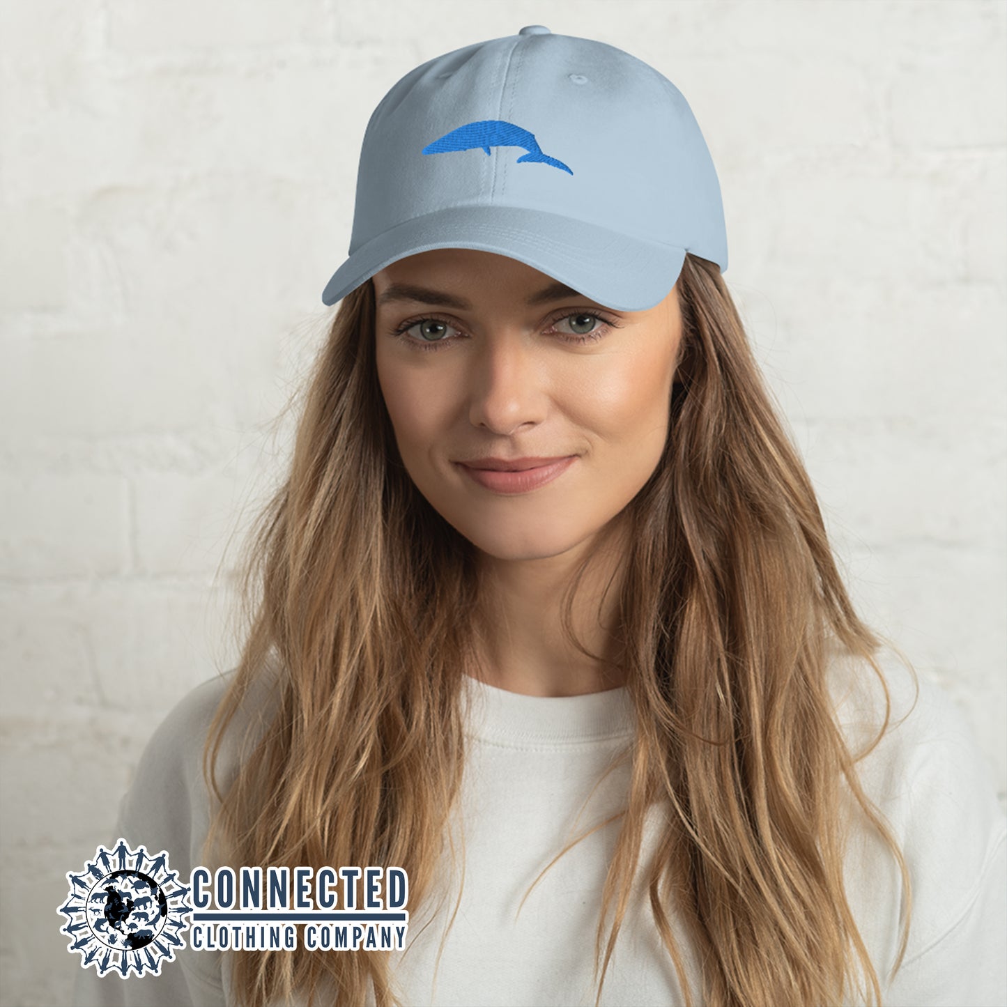 Model Wearing Blue Blue Whale Cotton Cap - sweetsherriloudesigns - 10% of profits donated to Mission Blue ocean conservation