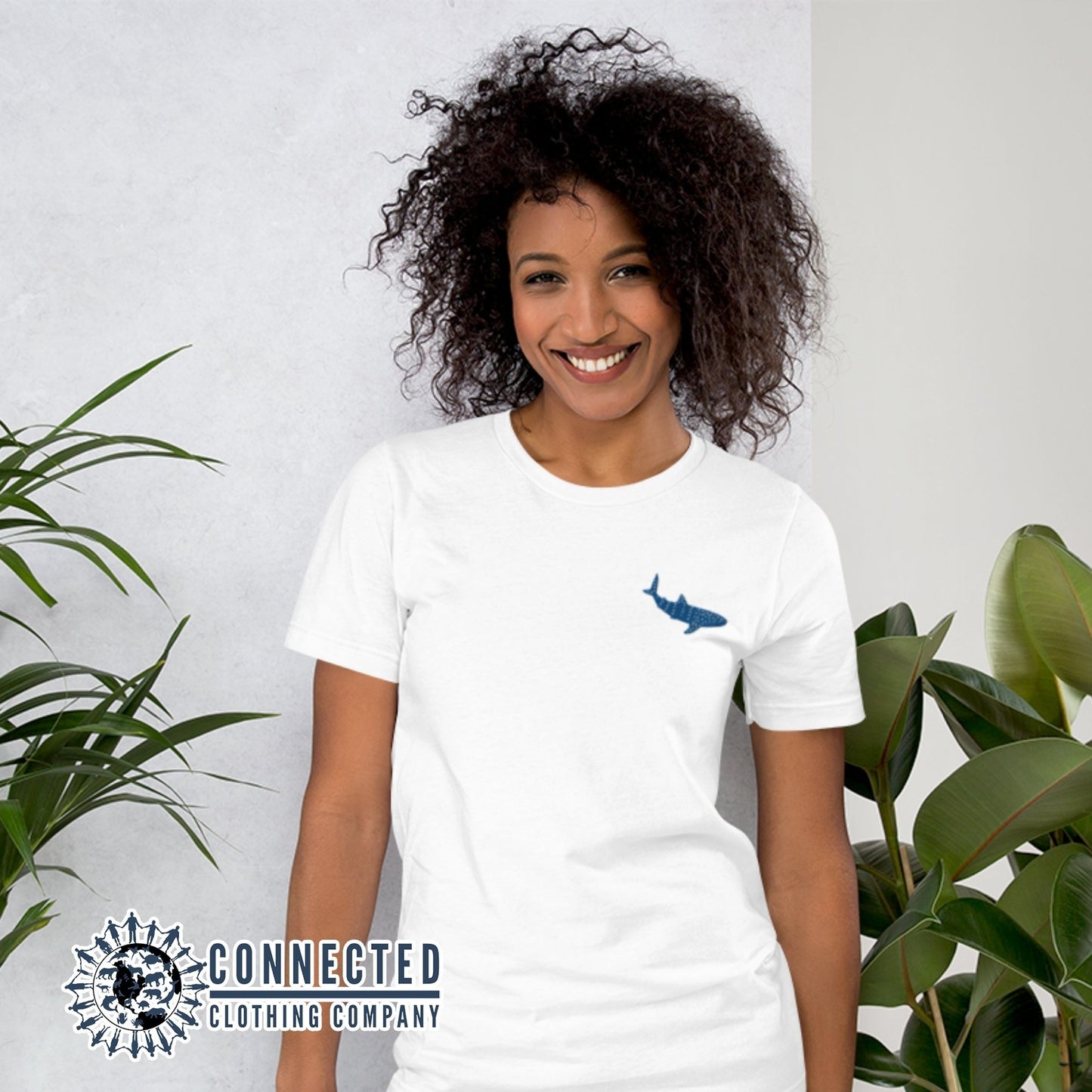 Model Wearing White Embroidered Whale Shark Short-Sleeve Shirt - sweetsherriloudesigns - Ethically and Sustainably Made - 10% of profits donated to shark conservation and ocean conservation