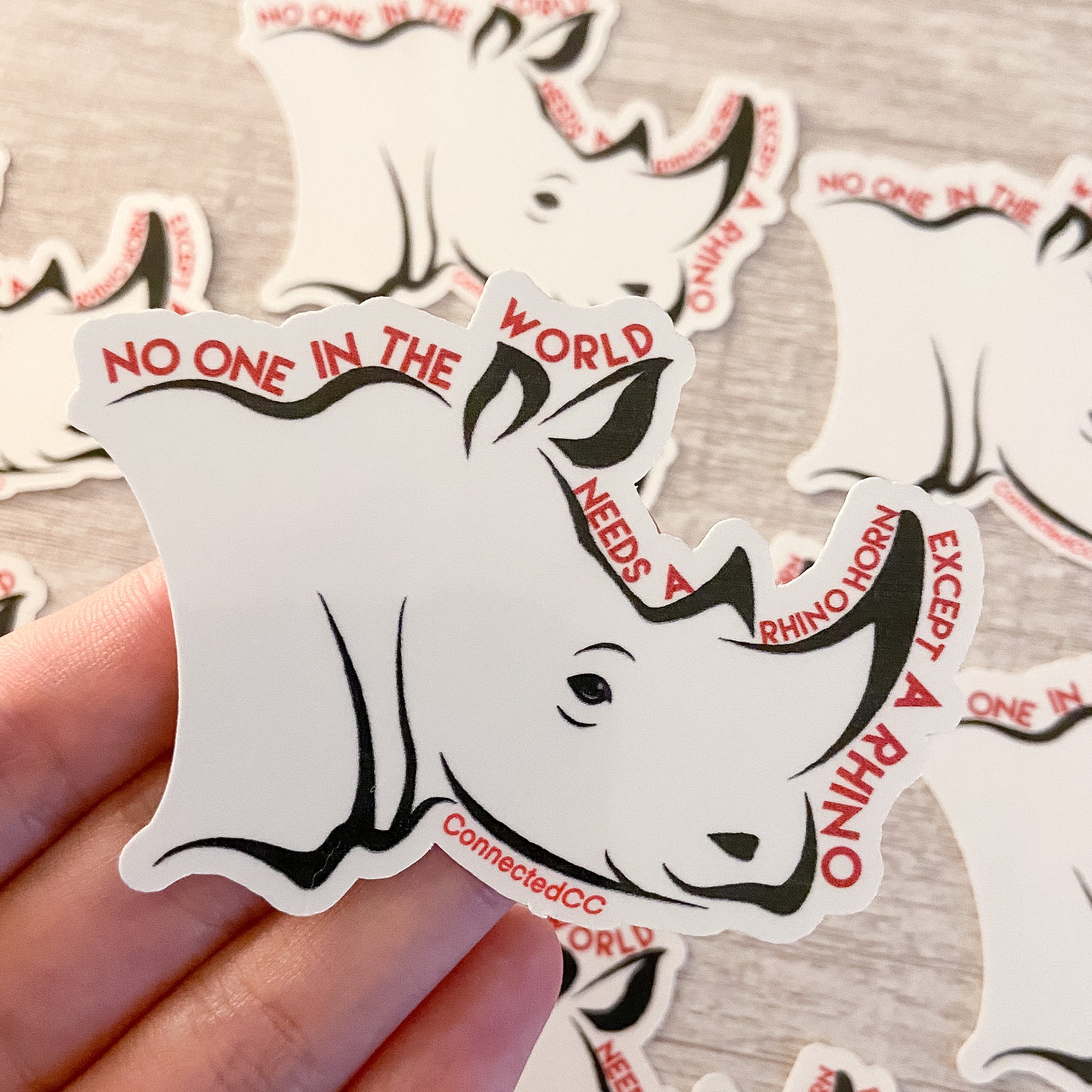 White No One Needs A Rhino Horn Sticker reads "No One In The World Needs A Rhino Horn Except A Rhino" - sweetsherriloudesigns - Ethically and Sustainably Made - 10% donated to Save The Rhino International