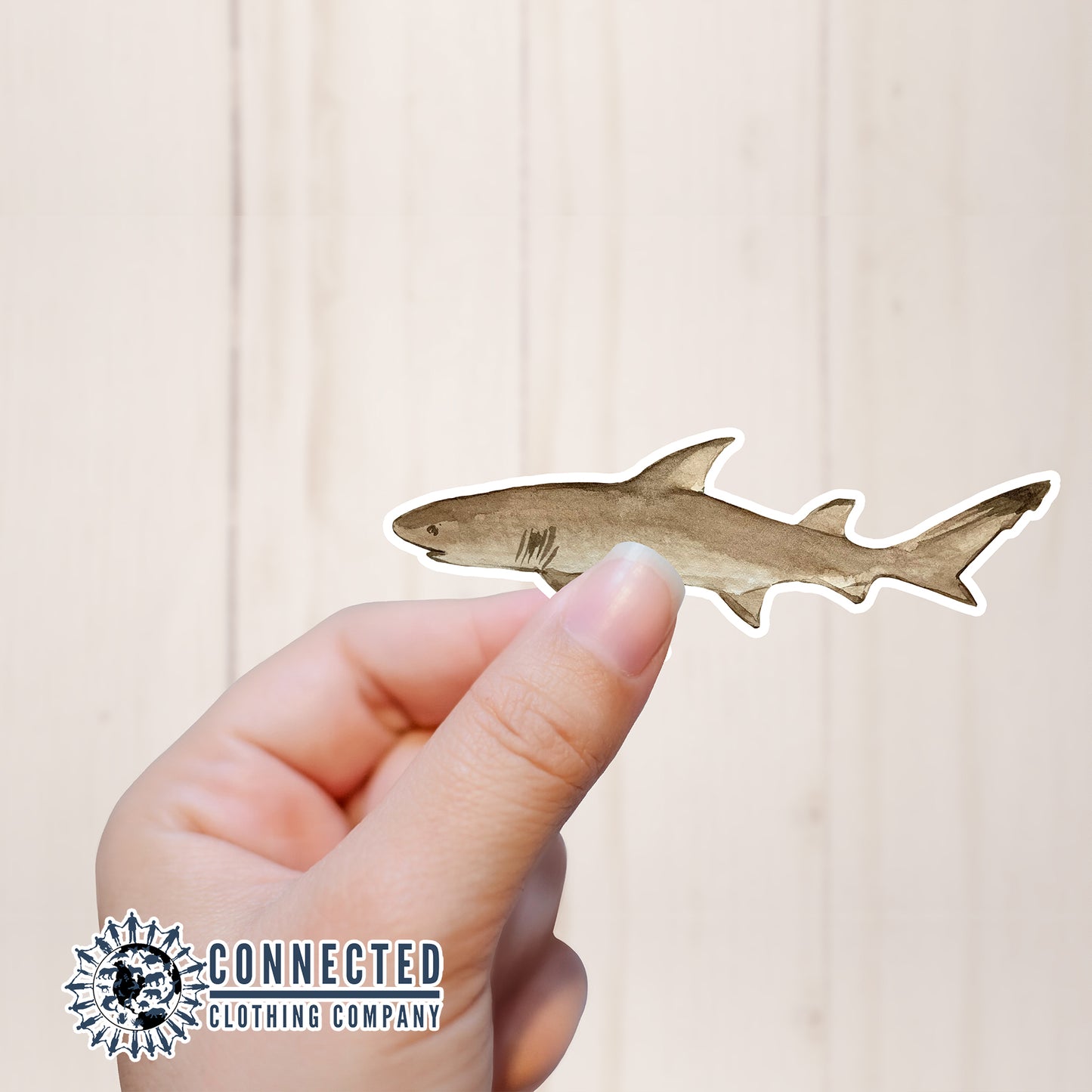 Hand Holding Lemon Shark Watercolor Sticker - sweetsherriloudesigns - Ethical and Sustainable Apparel - portion of profits donated to shark conservation