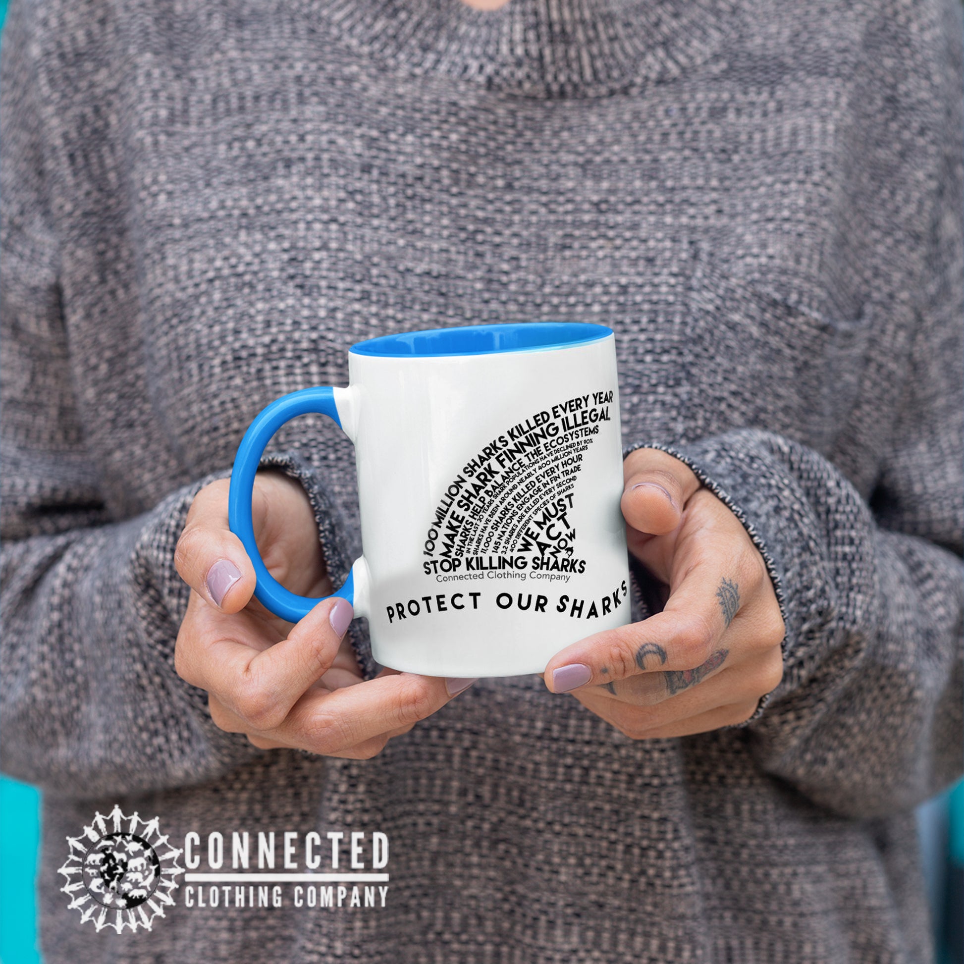 Model Holding Protect Our Sharks Mug With Blue Coloring on Inside, Rim, and Handle - sweetsherriloudesigns - Ethically and Sustainably Made - 10% donated to Oceana shark conservation
