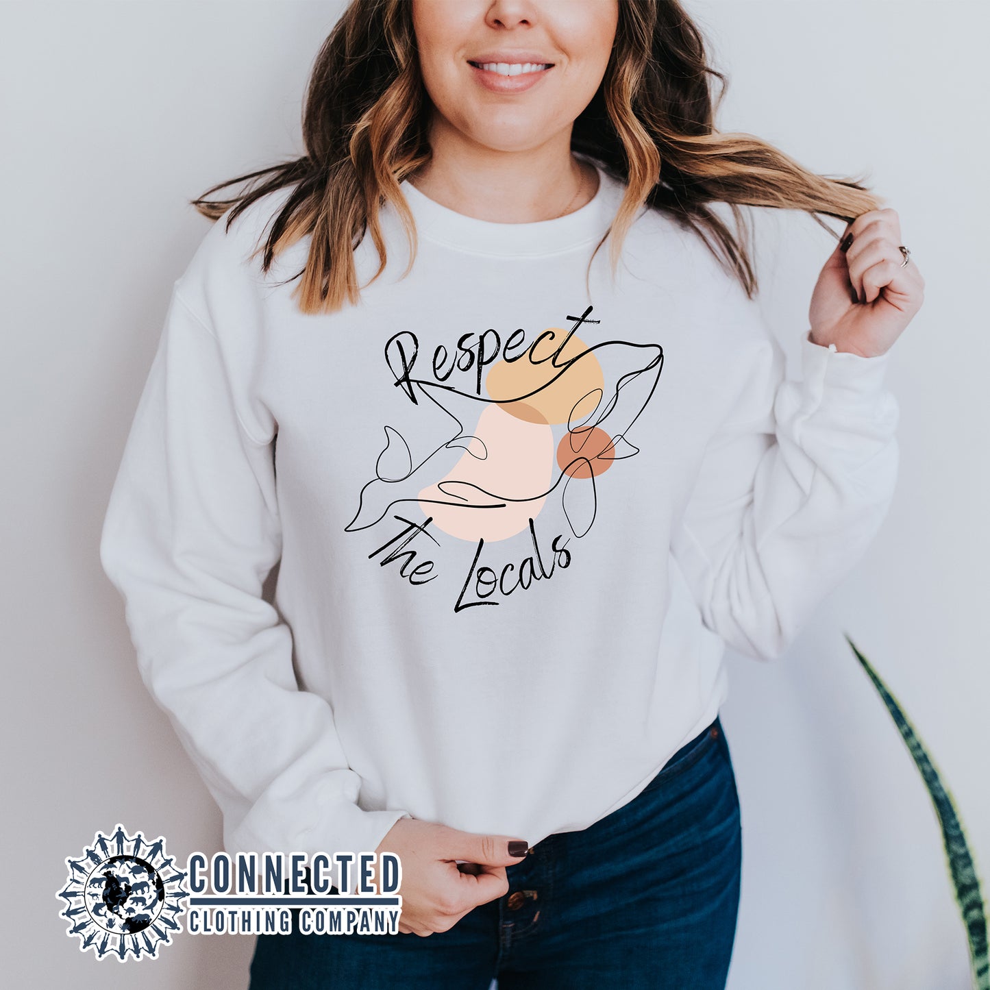 Model Wearing White Respect The Locals Orca Unisex Crewneck Sweatshirt - sweetsherriloudesigns - Ethically and Sustainably Made - 10% of profits donated to ocean conservation