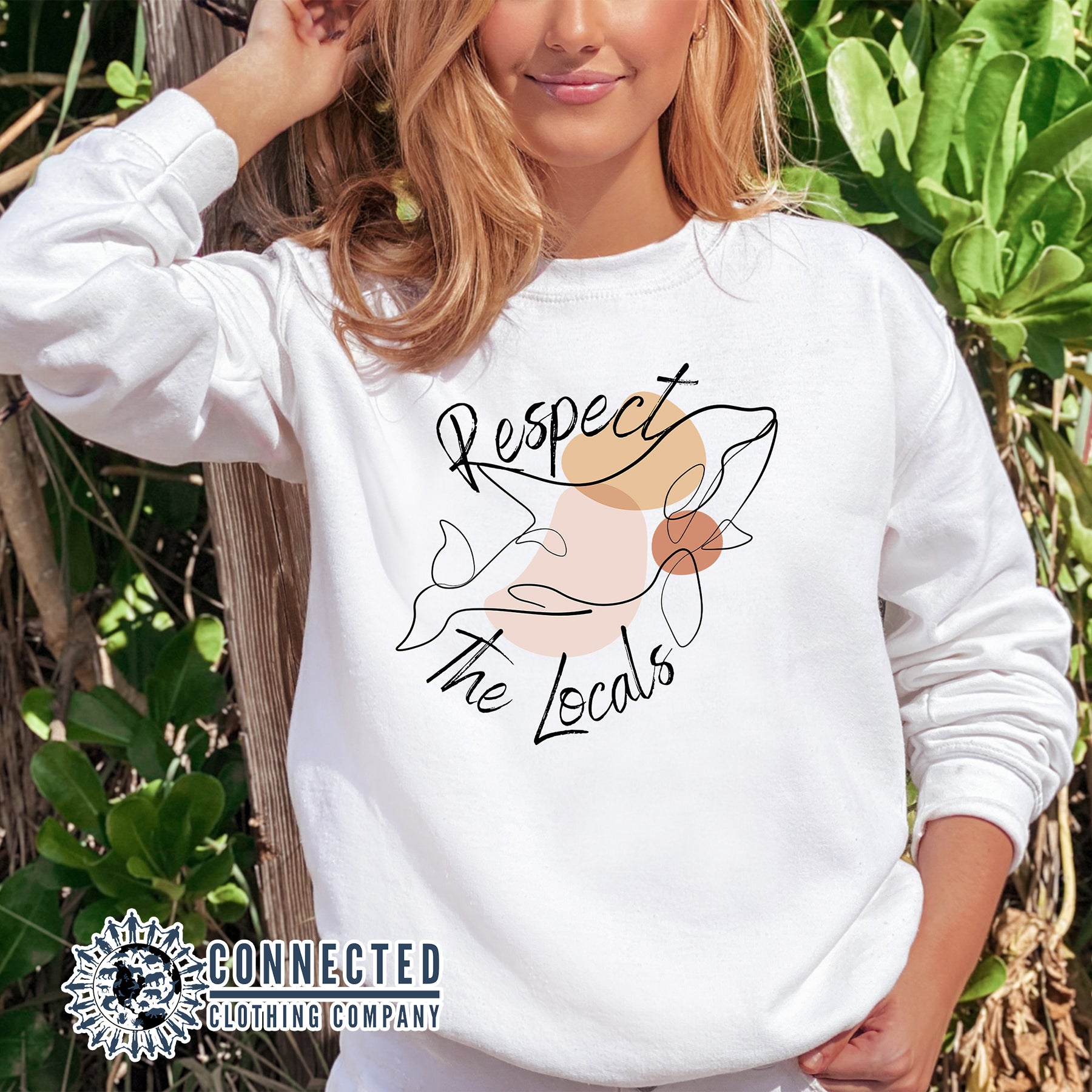 Model Wearing White Respect The Locals Orca Unisex Crewneck Sweatshirt - sweetsherriloudesigns - Ethically and Sustainably Made - 10% of profits donated to ocean conservation