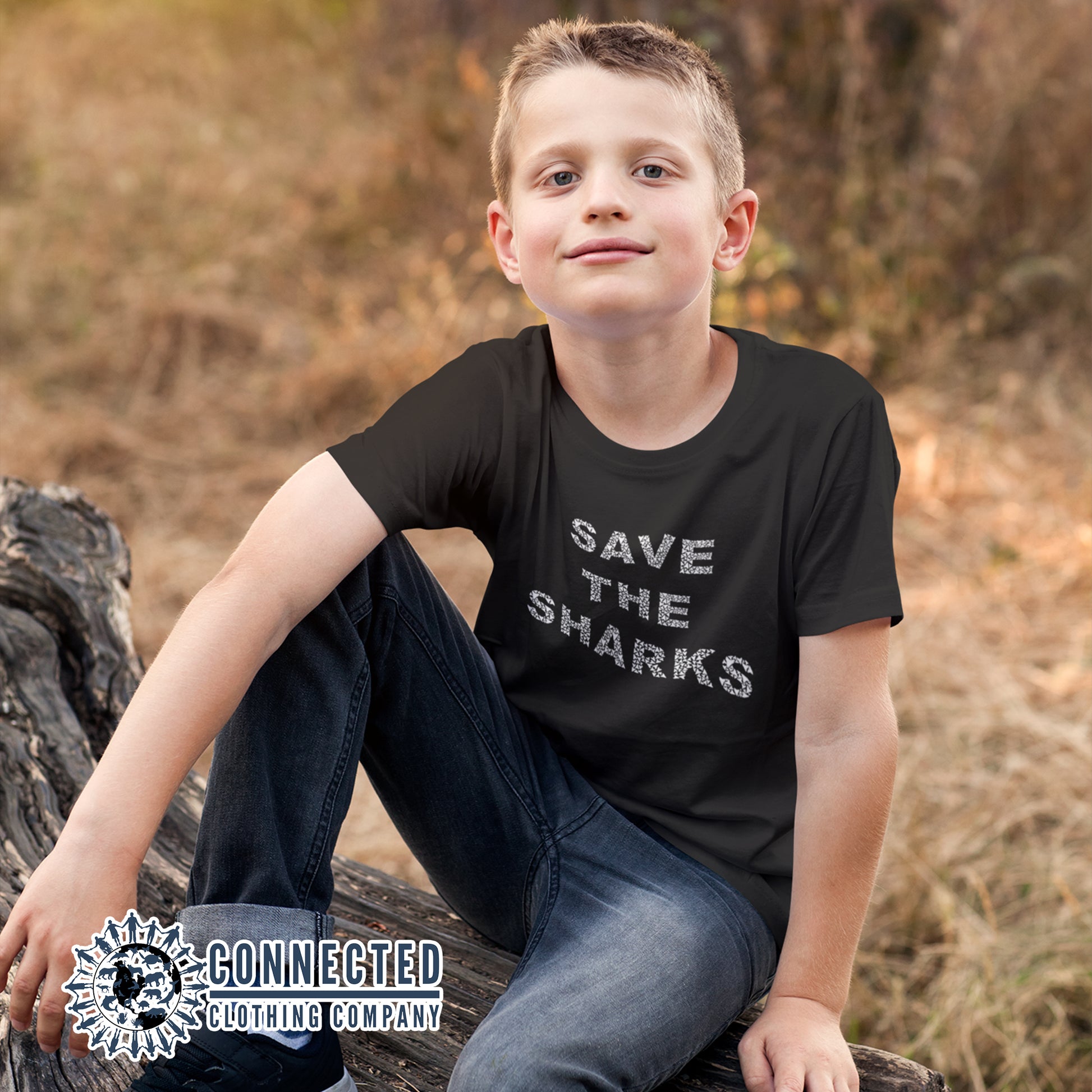 Boy Model Wearing Black Save The Sharks Youth Short-Sleeve Tee - sweetsherriloudesigns - 10% of profits donated to Oceana shark conservation
