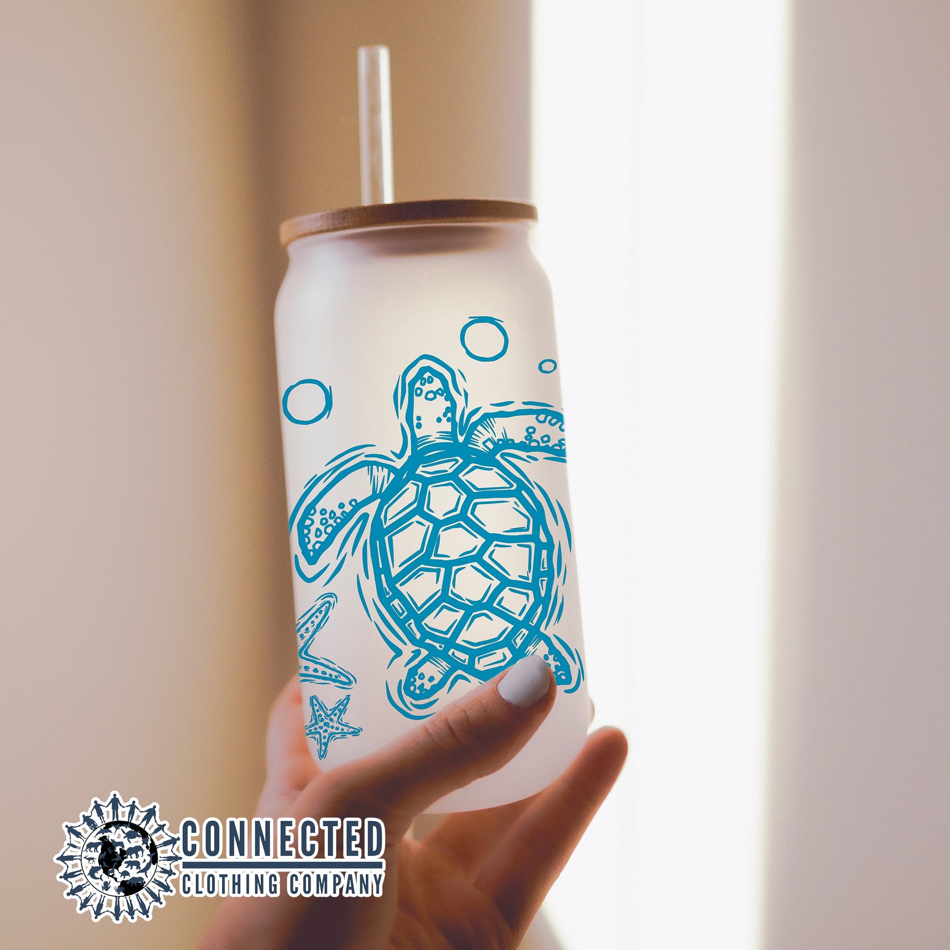 Spread awareness of the importance in our oceans diversity with this fun and bright glass cup that features a sea turtle, fish, starfish, and jellyfish.