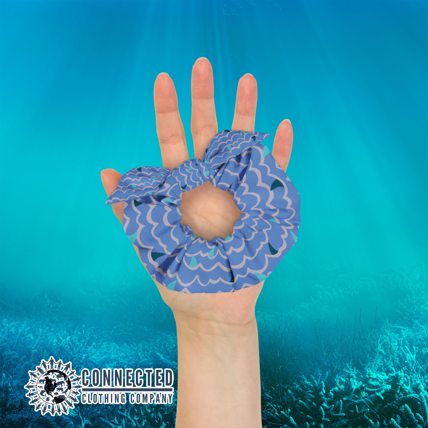 Hand Holding Shark Fin Scrunchie in Blue Color - sweetsherriloudesigns - Ethical & Sustainable Apparel - 10% donated to save the sharks