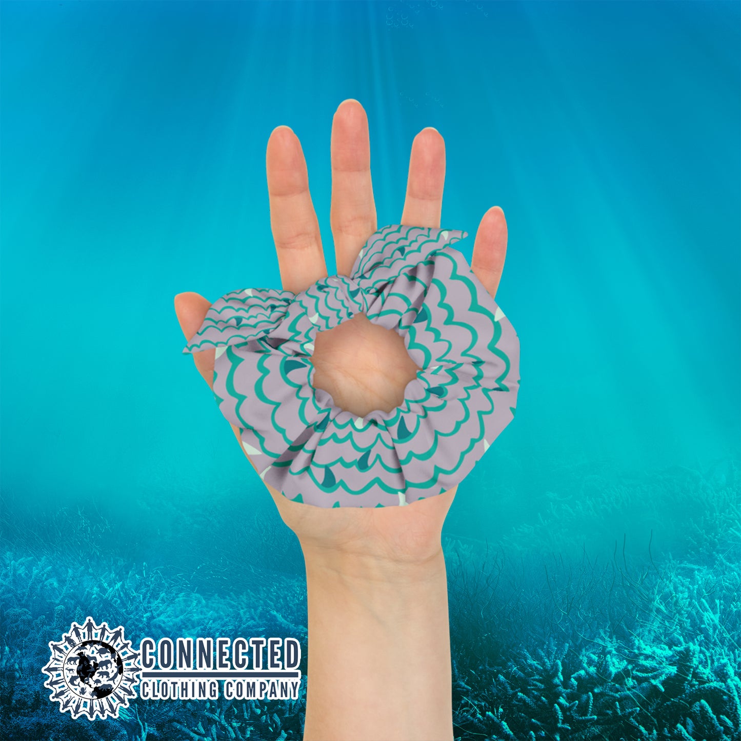 Hand Holding Shark Fin Scrunchie in Green Color - sweetsherriloudesigns - Ethical & Sustainable Apparel - 10% donated to save the sharks