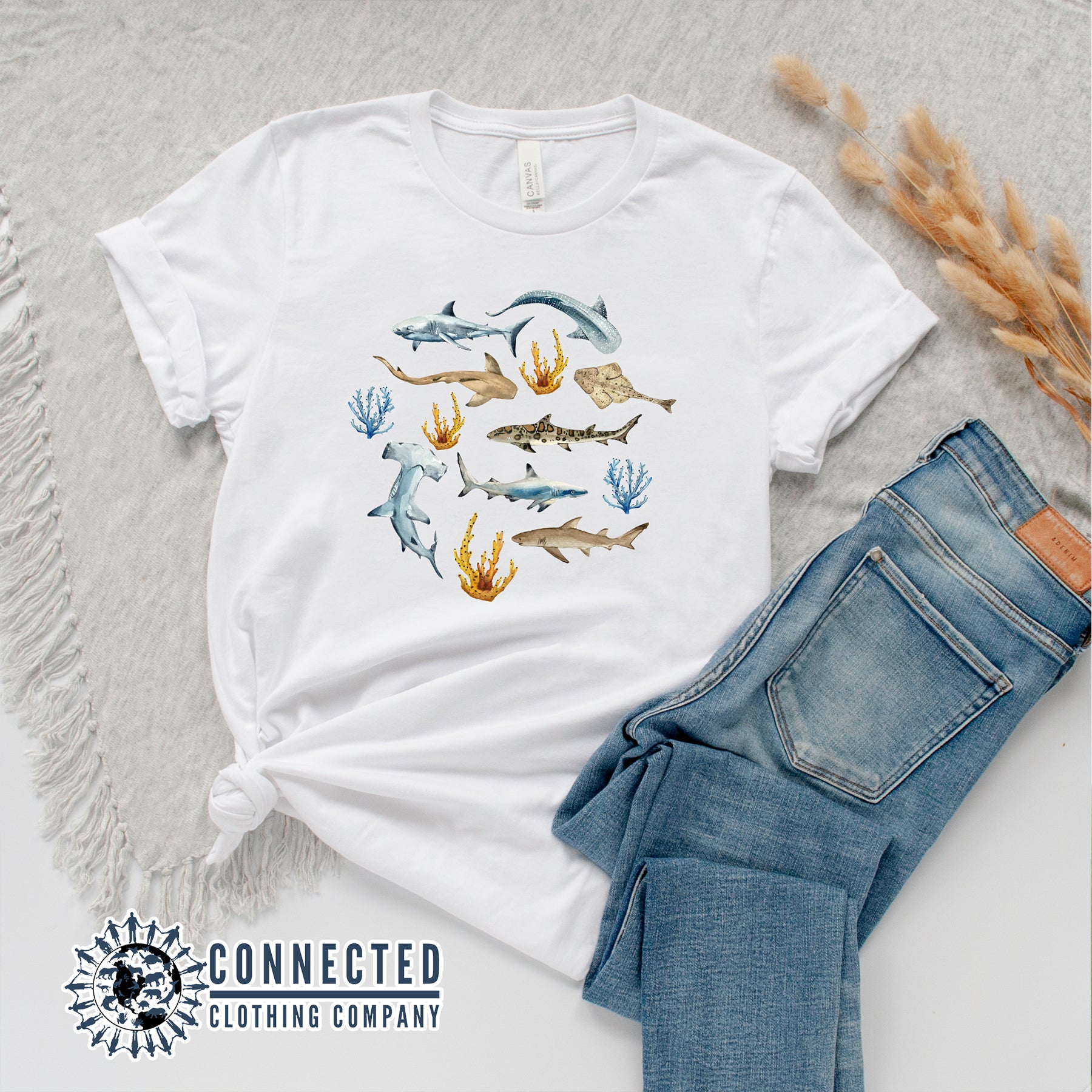 Flatlay of White Shark Ocean Watercolor Unisex Short-Sleeve Tshirt - sweetsherriloudesigns - Ethically and Sustainably Made - 10% of profits donated to shark conservation and ocean conservation