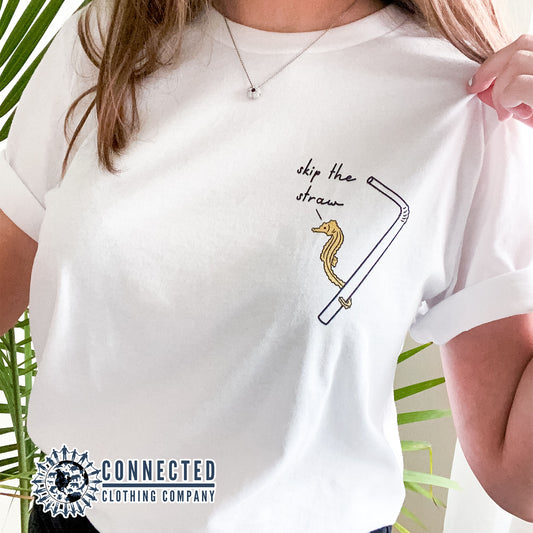 Model Wearing White Skip The Straw Seahorse Tee (Seahorse holding onto straw while saying skip the straw) - getpinkfit - Ethically and Sustainably Made - 10% donated to Mission Blue ocean conservation