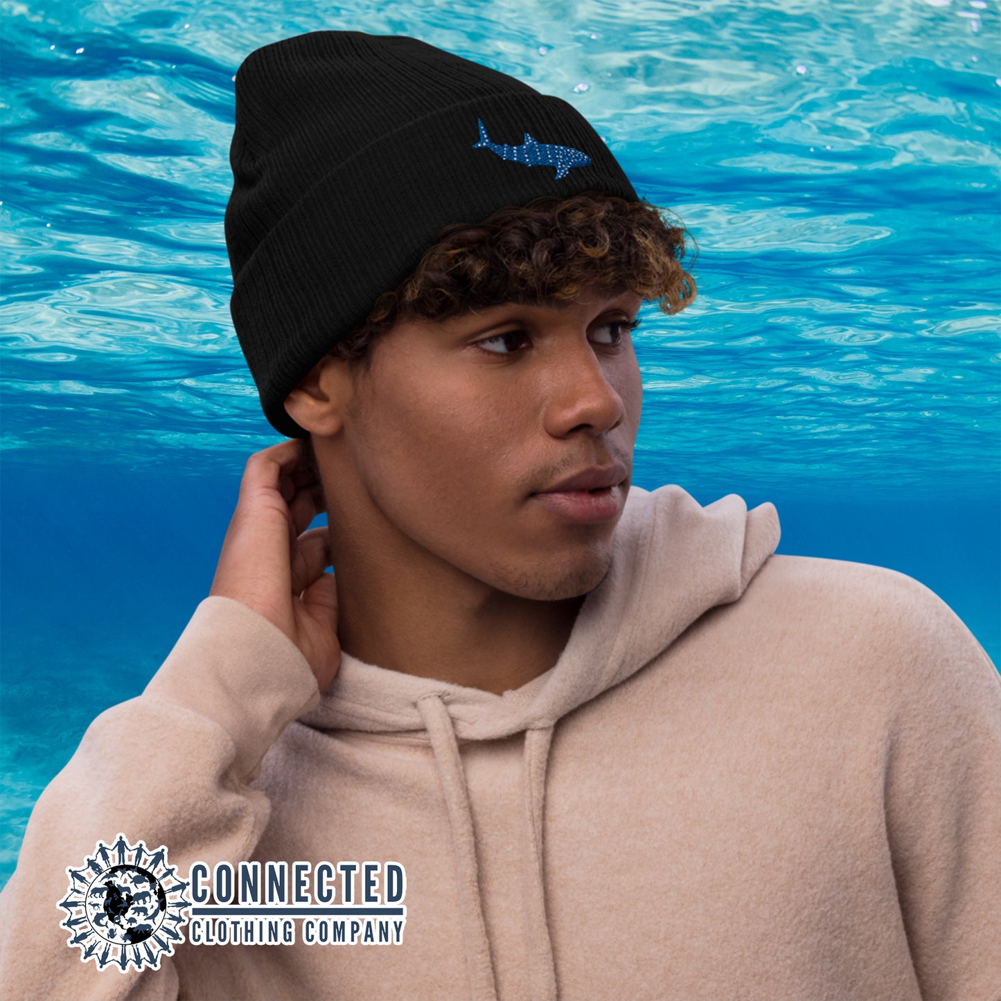 Model Wearing Black Whale Shark Embroidered Recycled Cuffed Beanie - sweetsherriloudesigns - Ethically and Sustainably Made - 10% donated to Mission Blue ocean conservation