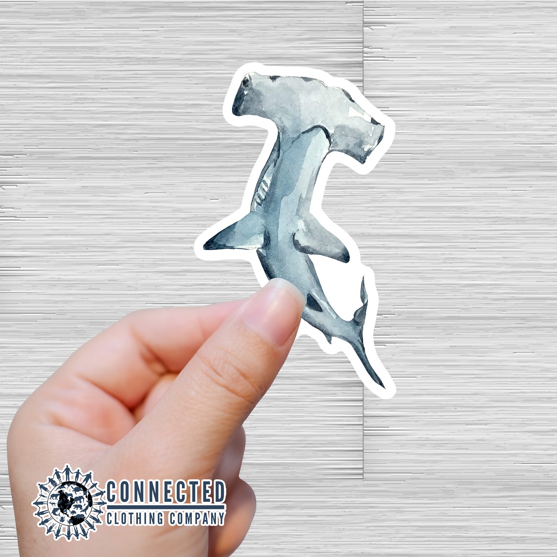 Hand Holding Hammerhead Shark Watercolor Sticker - sweetsherriloudesigns - Ethical and Sustainable Apparel - portion of profits donated to shark conservation