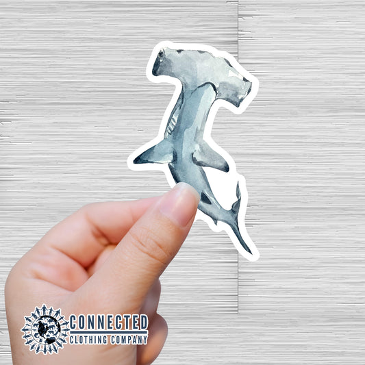 Hand Holding Hammerhead Shark Watercolor Sticker - sweetsherriloudesigns - Ethical and Sustainable Apparel - portion of profits donated to shark conservation