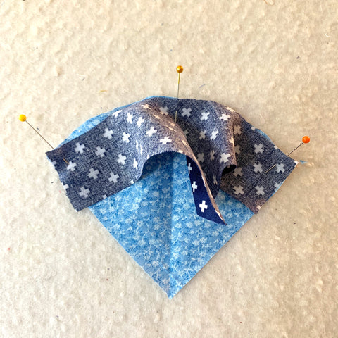 Sewing together a curved quilt piece