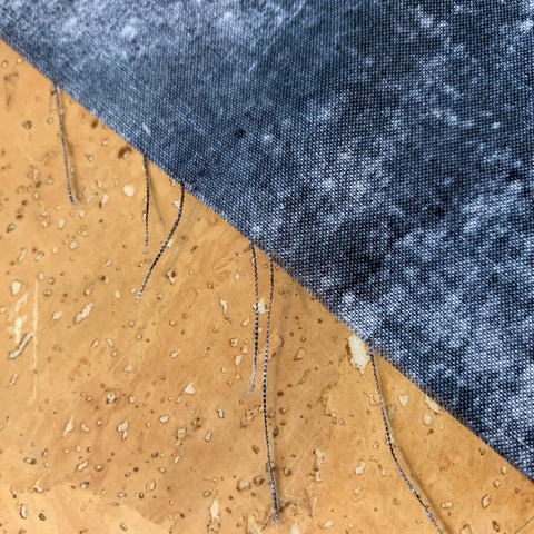 Frayed thread son the cut edge of the fabric