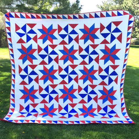 Bombs Bursting Quilt Pattern in red, white, and blue.