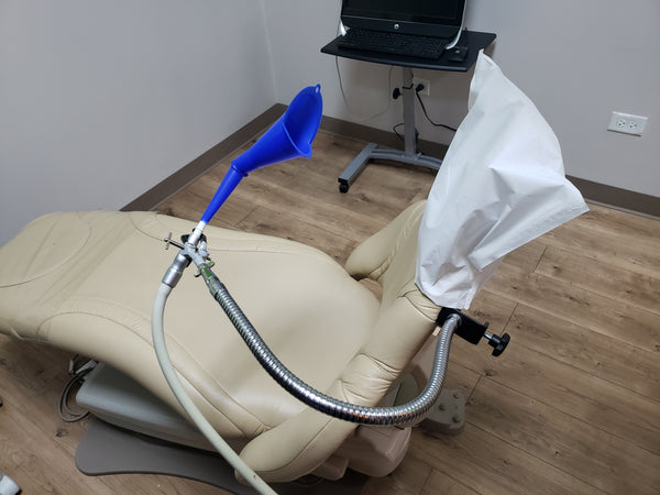 SnakeClamp high volume evacuation suction that is meant to reduce aerosol so that a hygienist doesn't have to hold it on his/her own and can use both hands for treatment