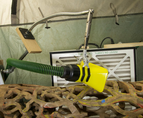 Versatile 3 Finger Clamp shown supporting a vacuum hose with a flexible gooseneck tube arm