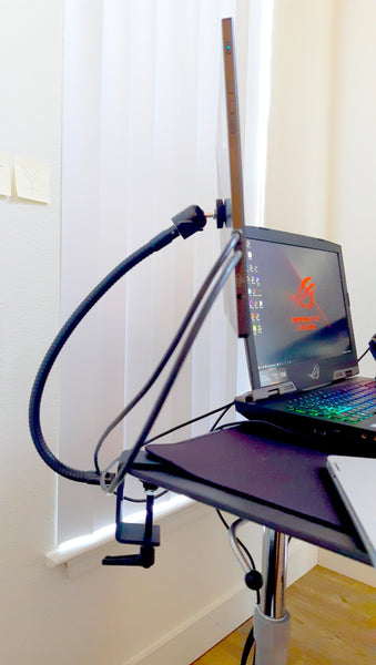 In this photo you can see that the ASUS portable gaming monitor is attached to the desktop with our Megaclamp with 