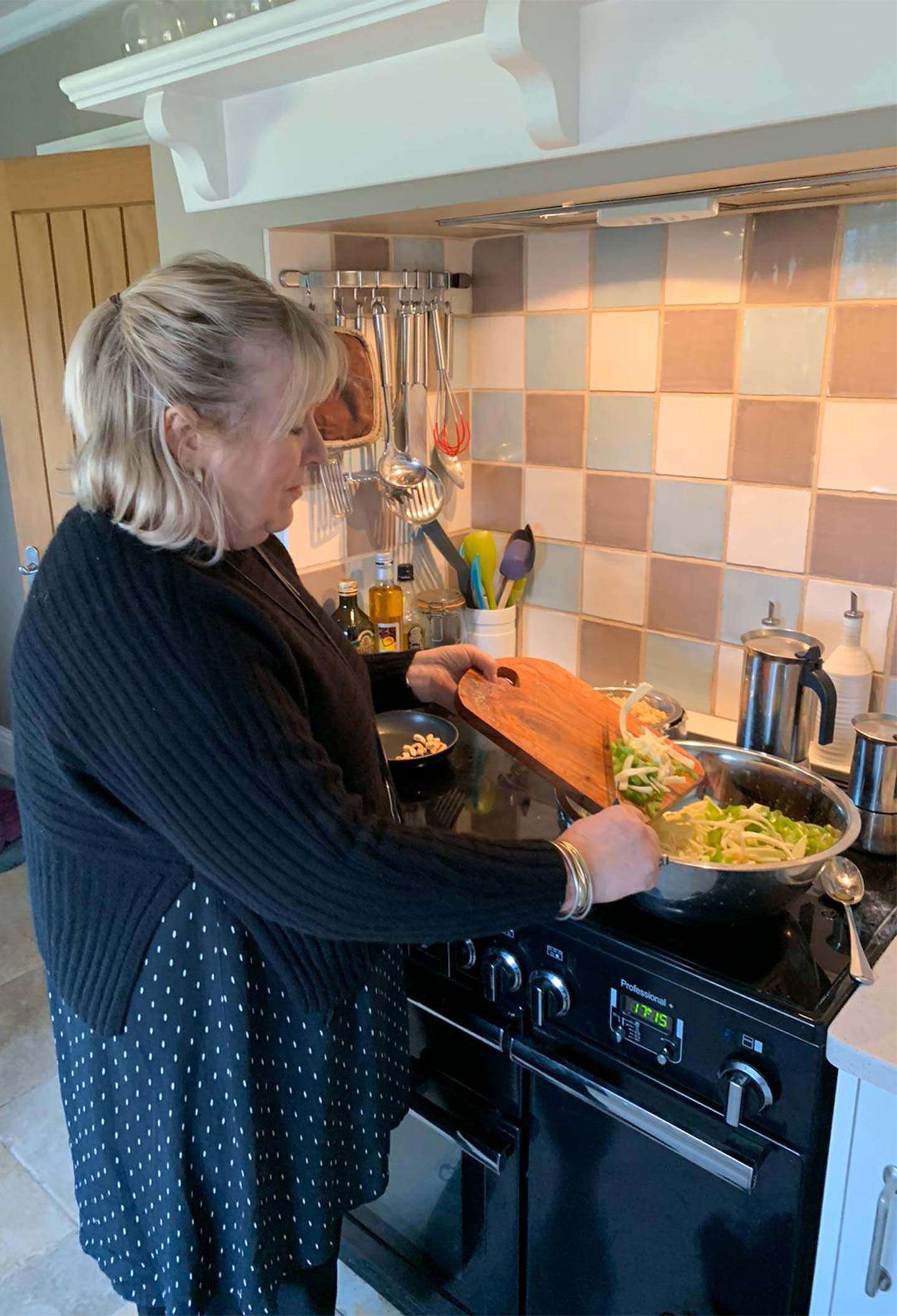 bridget cooking in black cashmere jumper