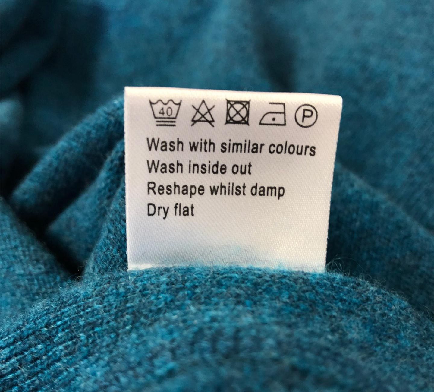 kingfisher cashmere scarf with washing symbols explained on label