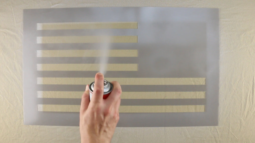 Use Repositionable Spray Adhesive on the back of the stripes stencil