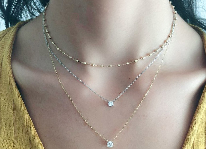 Jessica Jewellery's floating diamond necklace featuring a solitaire diamond on a delicate gold chain, a favourite among clients and Instagram followers.