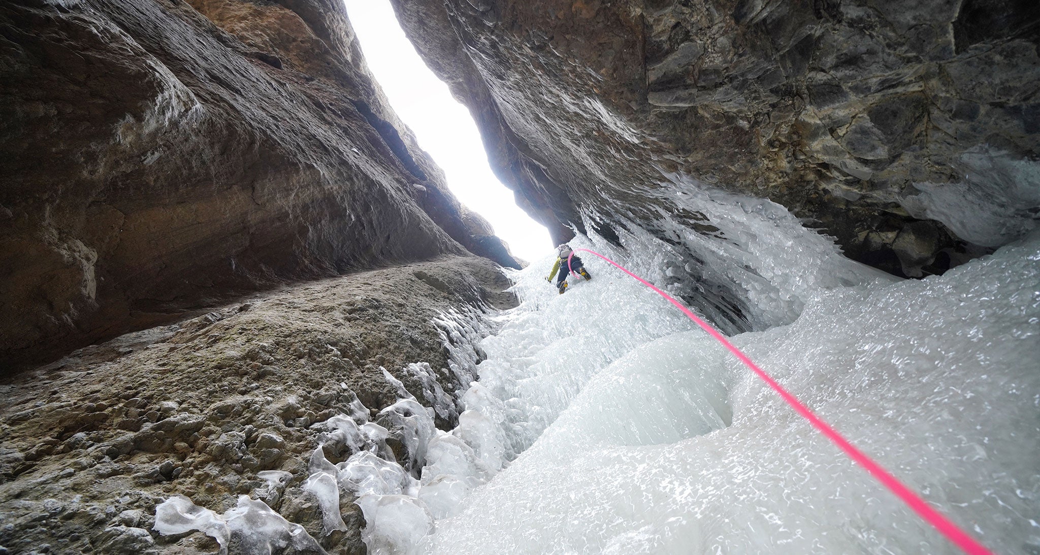 Belayer captures ice climber on a waterfall