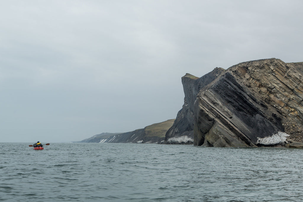 Daniel Countiss paddles in the Chukchi Sea