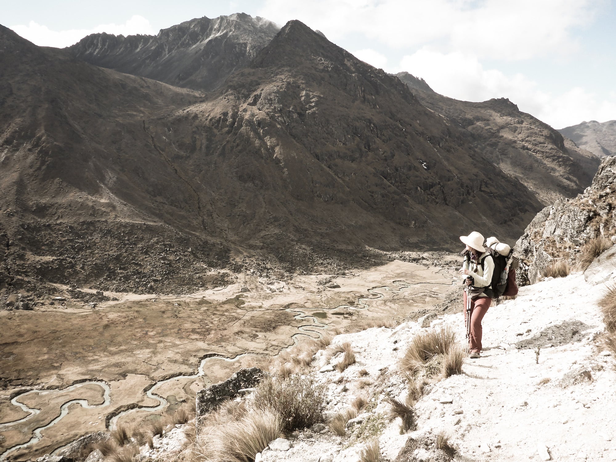 Ultralight backpacker looks over a valley