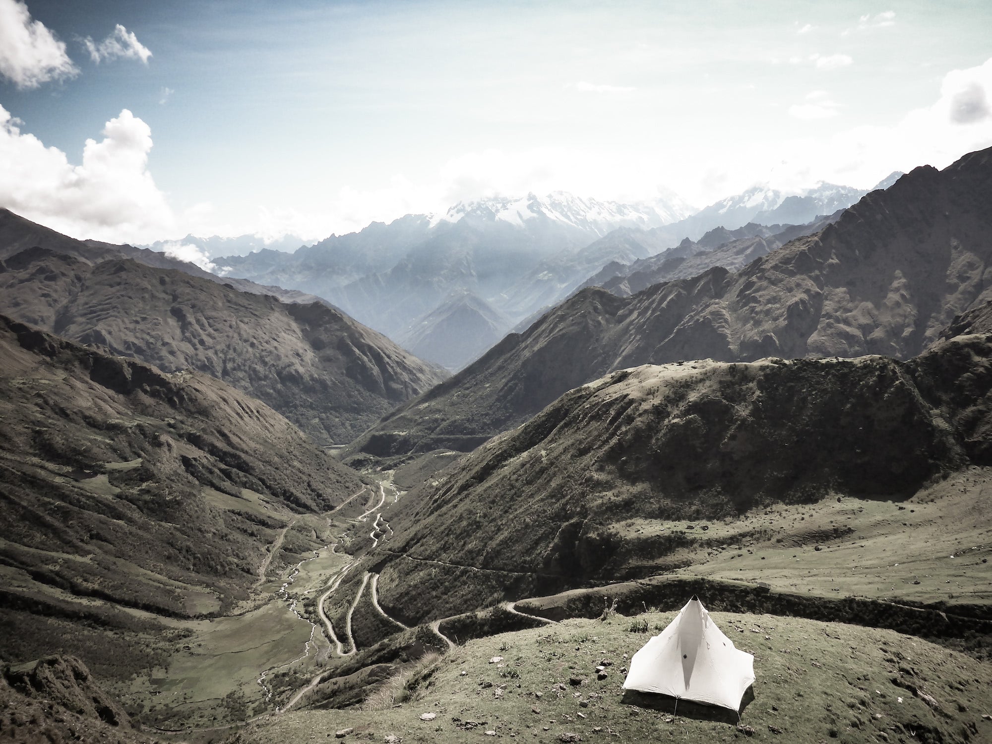 Ultralight tent pitched overlooking a valley