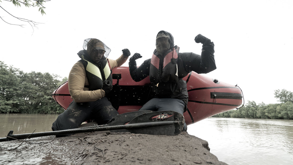 Ultralight backpackers pose with their packraft