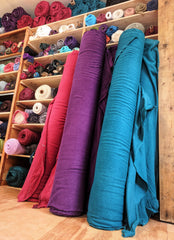 Studio Picture: Yana Dee Custom Color Hemp Fleece Fabric Bolts in Red, Purple, and Teal