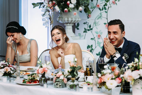 Bride_and_Groom_laughing_at_wedding_speech