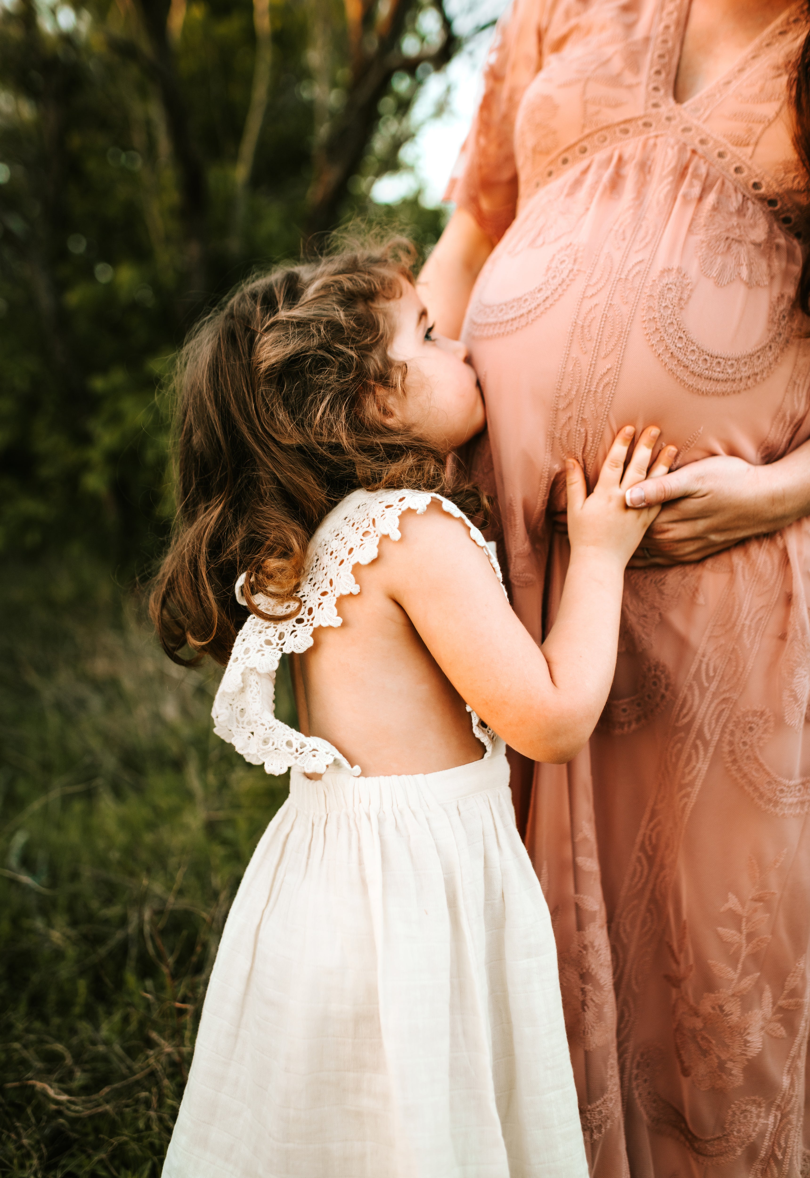 Little Girl Kissing Her Unborn Sibling