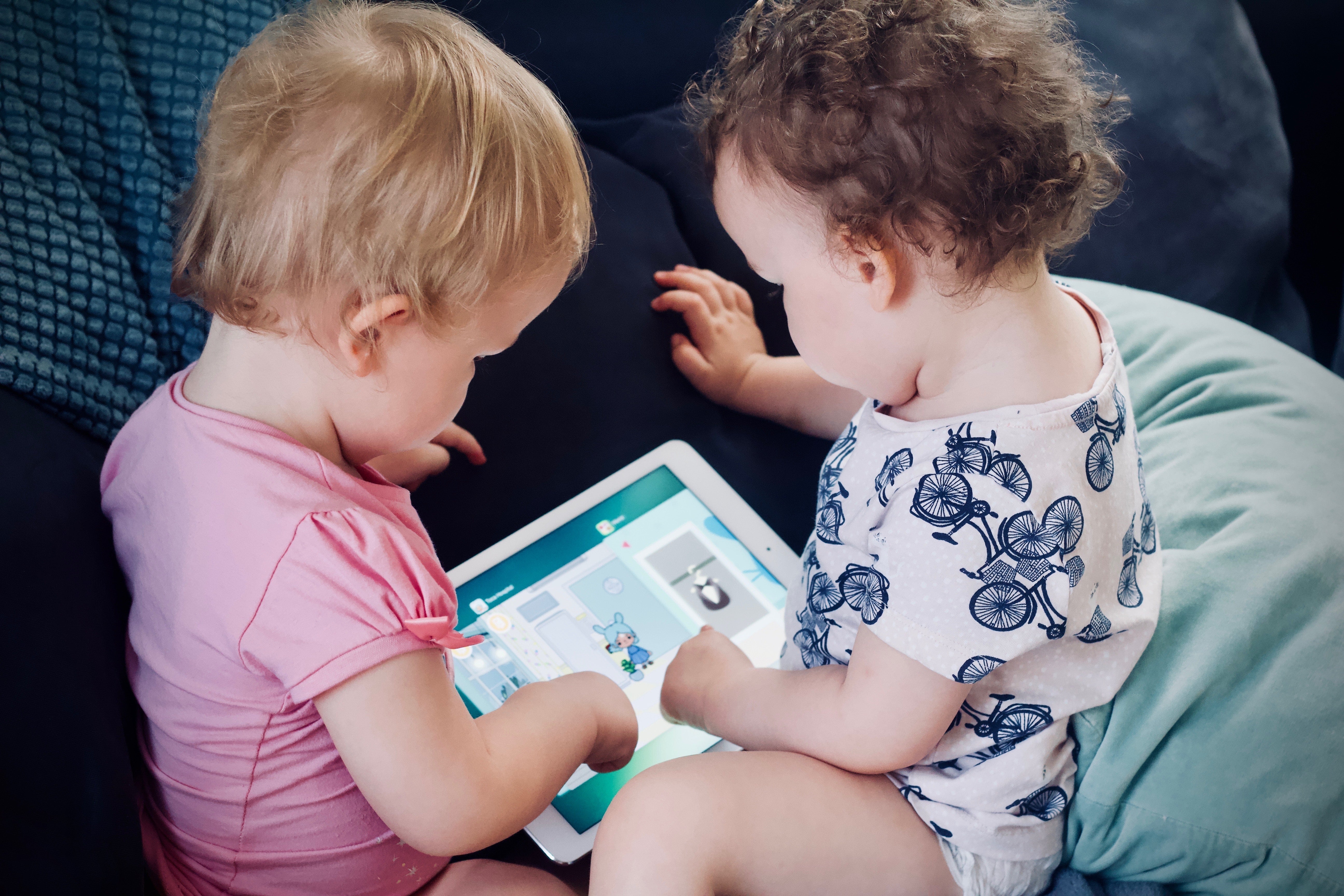 Toddlers Playing on a Tablet Together - Sibling Photo Idea
