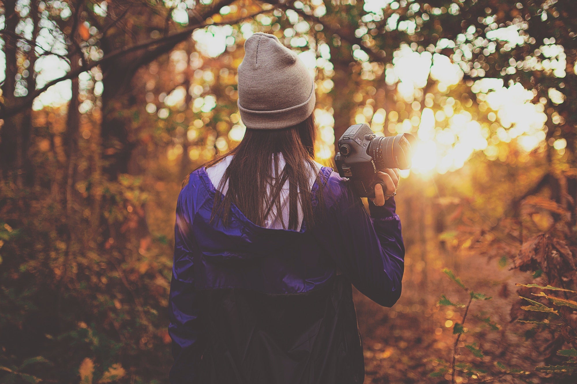 Autumn Photography Tips - Woman in Forest with Canon DSLR Camera