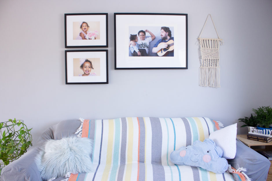 Family Room Displaying a Gallery Wall of Framed Prints by Posterjack